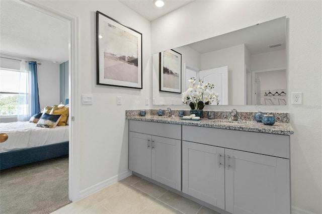 bathroom featuring tile patterned flooring and vanity