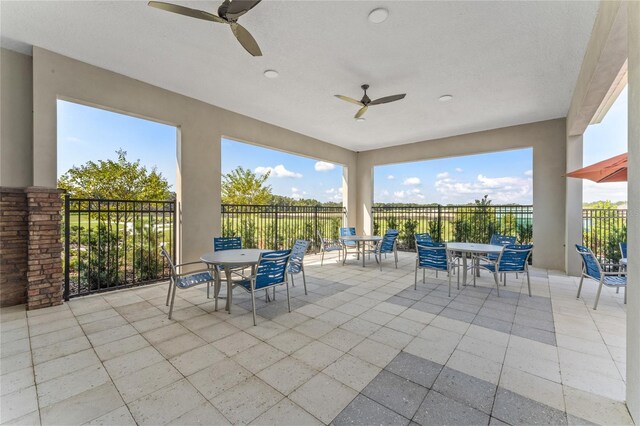 view of patio / terrace with outdoor dining area and fence