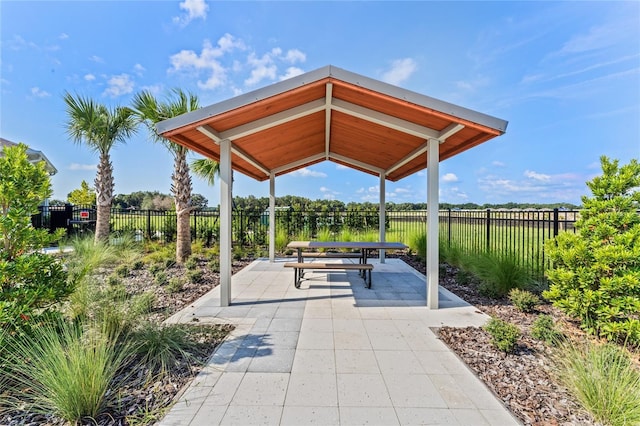 view of community featuring a gazebo, a patio area, and a fenced backyard