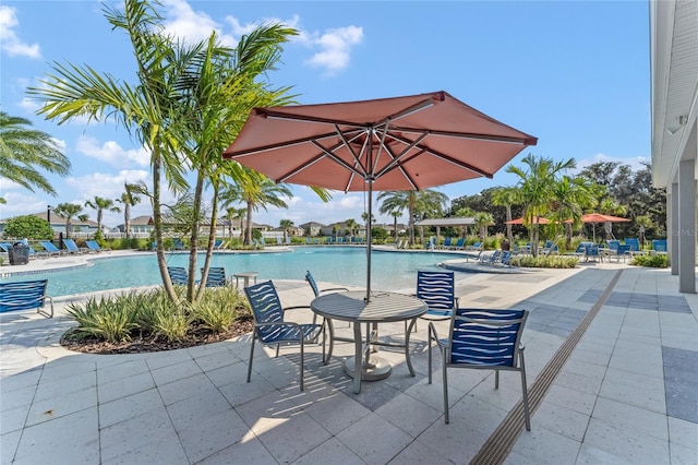 community pool featuring a patio area