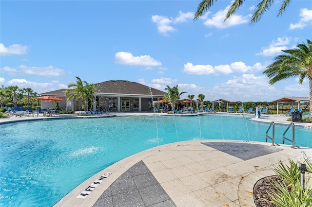 view of pool featuring a patio and pool water feature