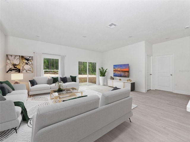 living room with light hardwood / wood-style flooring