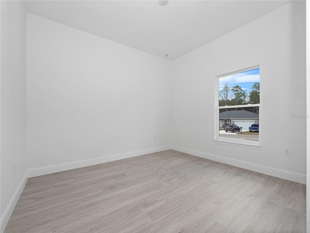 unfurnished room featuring light hardwood / wood-style flooring