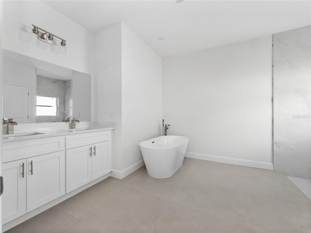 bathroom with vanity and a bath