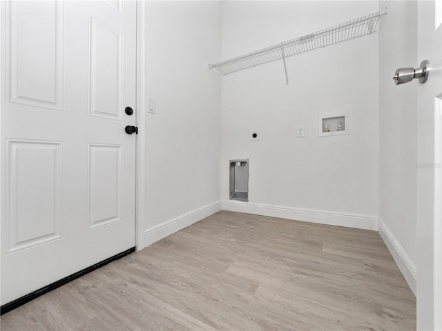 clothes washing area with hookup for a washing machine, light hardwood / wood-style flooring, and hookup for an electric dryer