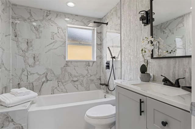 full bathroom featuring vanity, toilet, and tiled shower / bath