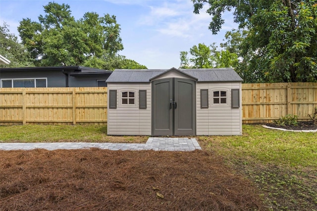 view of outdoor structure with a lawn