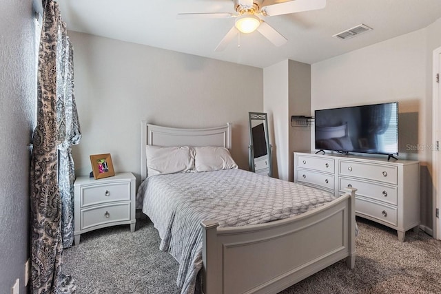 bedroom featuring dark colored carpet and ceiling fan