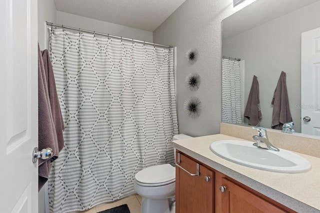 bathroom with vanity, toilet, and a shower with curtain