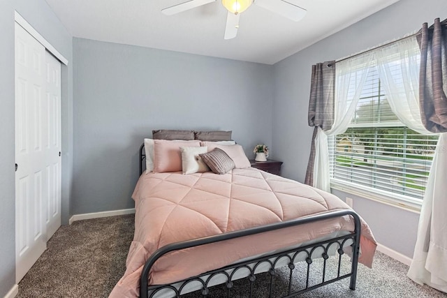 bedroom with a closet, ceiling fan, and carpet floors