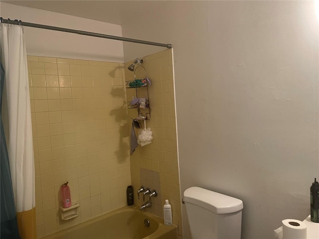 bathroom with toilet and shower / bathtub combination with curtain