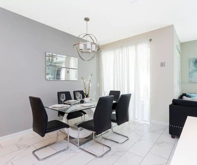 dining room featuring a chandelier