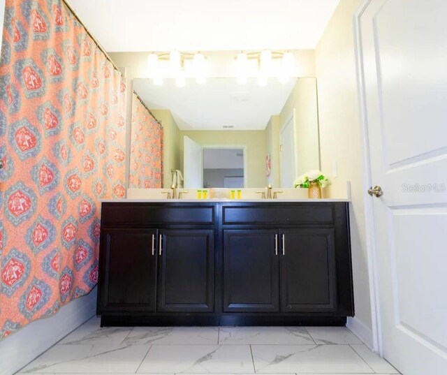 bathroom featuring shower / tub combo with curtain and vanity