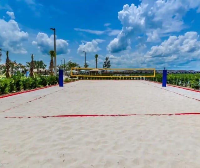 view of property's community featuring volleyball court