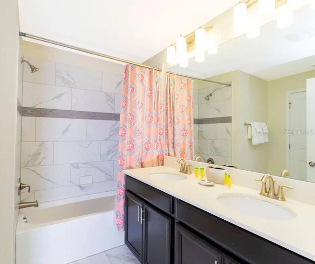 bathroom with vanity and shower / bath combo