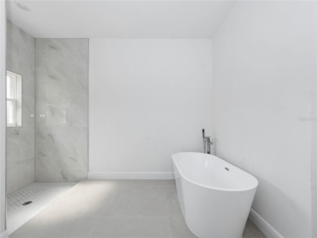 bathroom with tile patterned floors and plus walk in shower