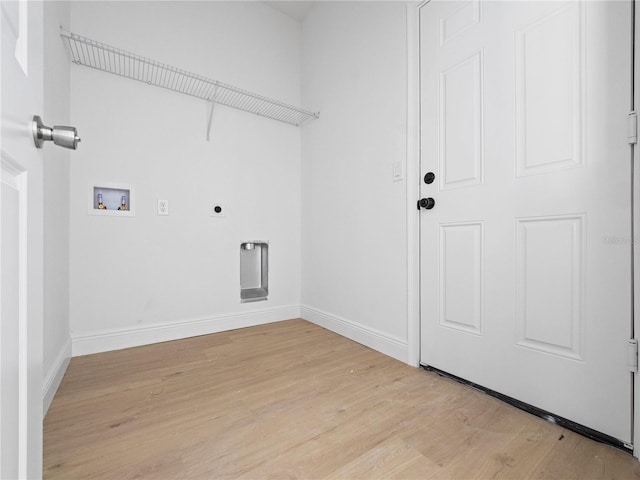 laundry room featuring electric dryer hookup, light wood-style flooring, baseboards, hookup for a washing machine, and laundry area