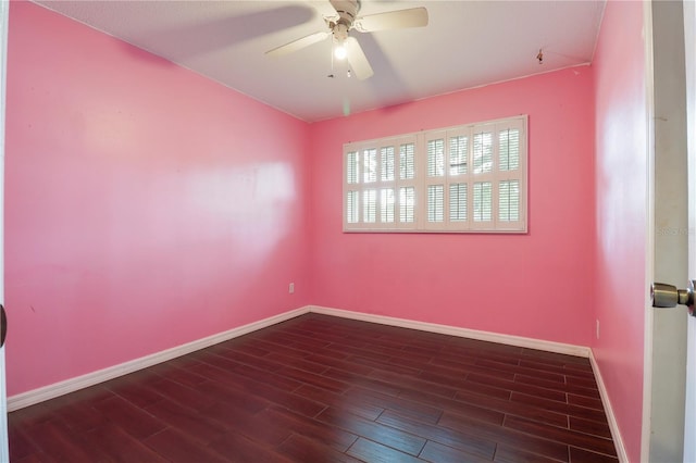 unfurnished room with ceiling fan and dark wood-type flooring