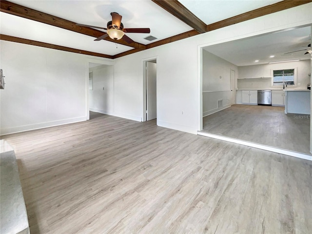 unfurnished living room with baseboards, visible vents, light wood finished floors, beam ceiling, and ceiling fan