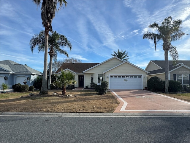 view of front of house with a front yard and a garage