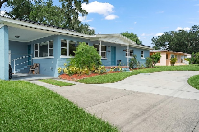 ranch-style house with a front lawn