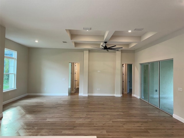 spare room featuring hardwood / wood-style floors and ceiling fan