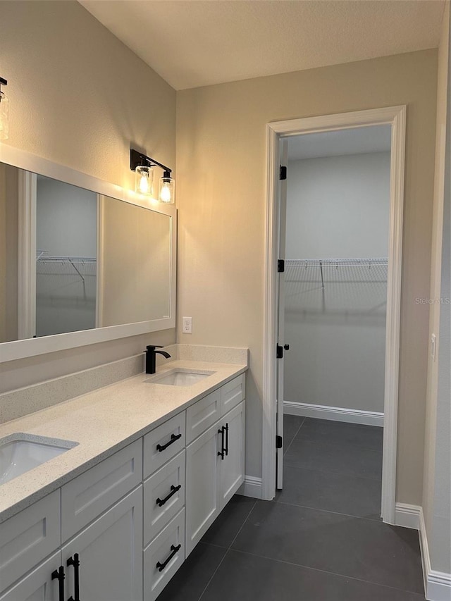 bathroom with vanity and tile patterned flooring