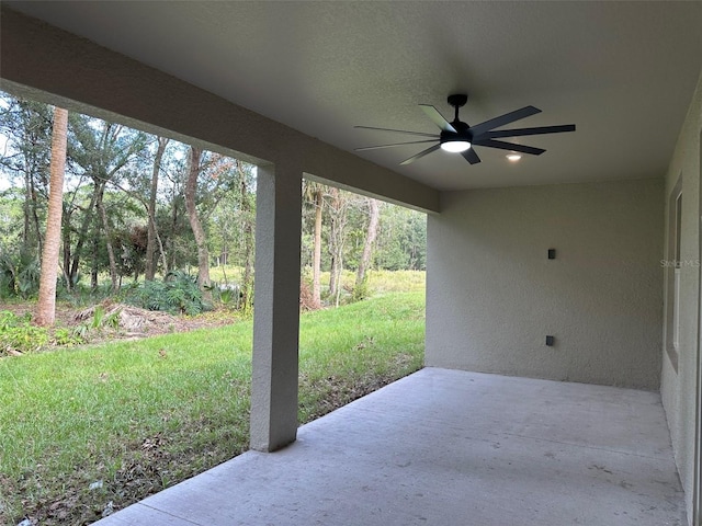 view of patio featuring ceiling fan