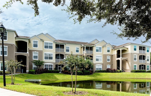 view of building exterior featuring a water view