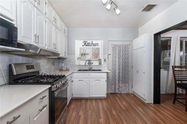 kitchen with dark wood-type flooring, sink, white cabinetry, and stainless steel gas range oven