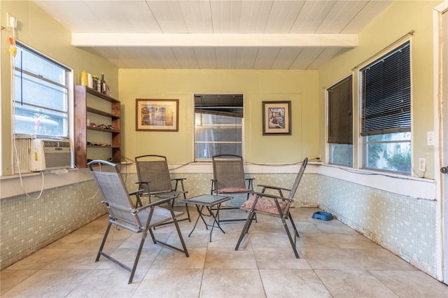 sunroom with wooden ceiling, beamed ceiling, and a healthy amount of sunlight