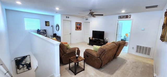 carpeted living room featuring ceiling fan