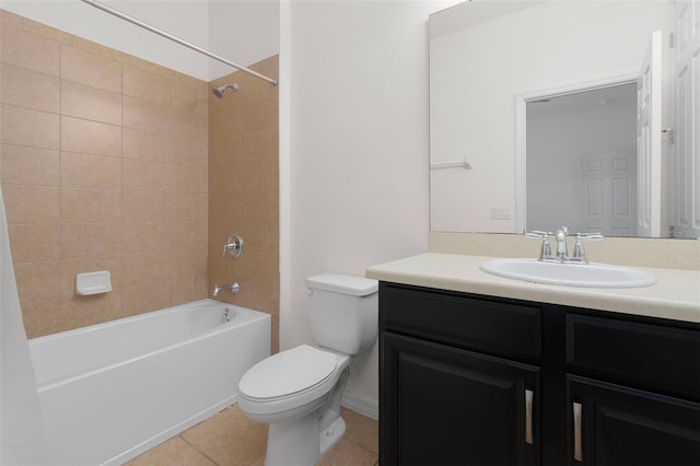 full bathroom featuring tile patterned floors, tiled shower / bath combo, toilet, and vanity