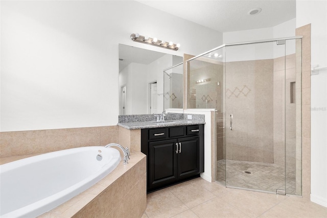 bathroom featuring tile patterned flooring, vanity, and independent shower and bath