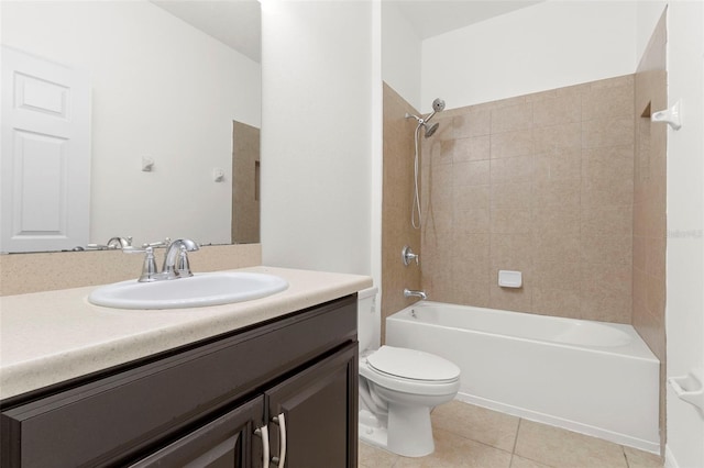 full bathroom featuring toilet, vanity, tile patterned floors, and tiled shower / bath combo