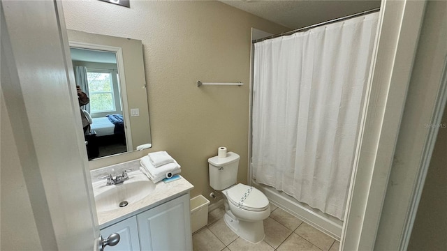 bathroom featuring tile patterned flooring, vanity, toilet, and a shower with shower curtain