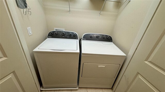 laundry area with washing machine and dryer