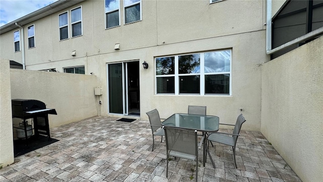 rear view of property featuring a patio area