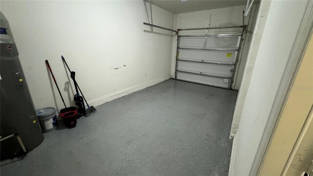 3167 Tocoa Cir, Kissimmee, FL 34746 - garage featuring baseboards