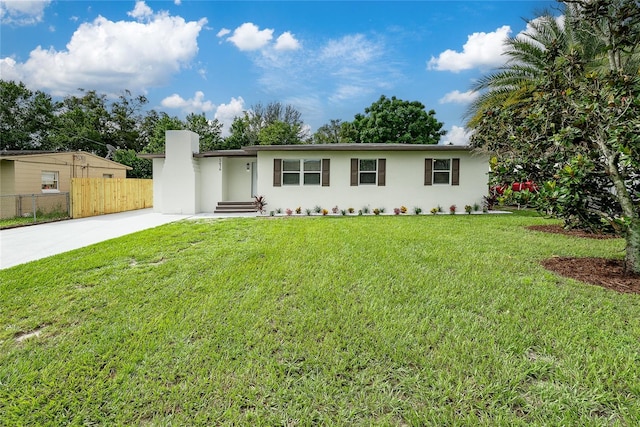 single story home with a front lawn