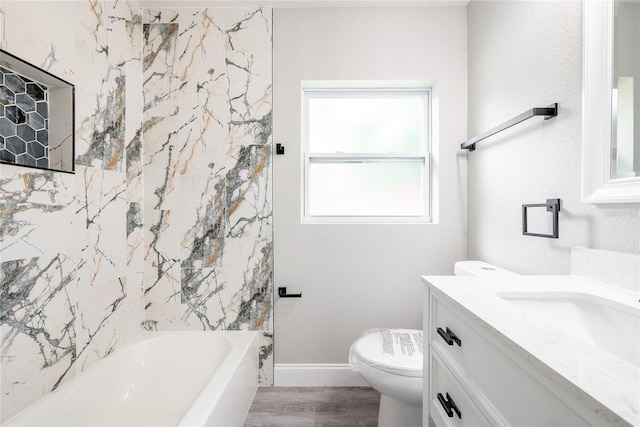 full bathroom featuring tiled shower / bath combo, vanity, toilet, and wood-type flooring