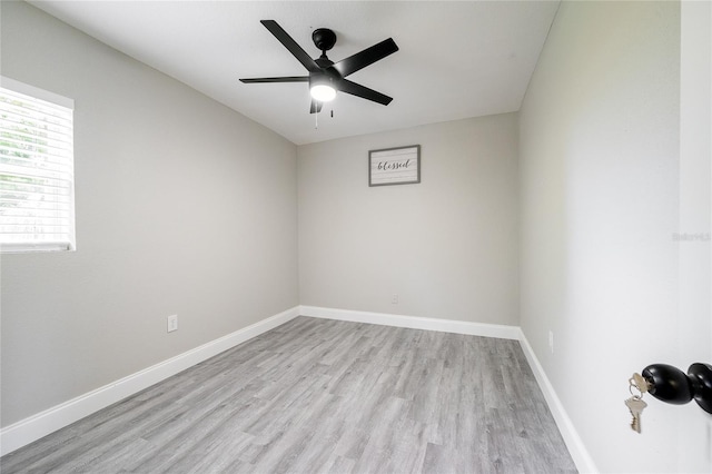 unfurnished room featuring light hardwood / wood-style flooring and ceiling fan