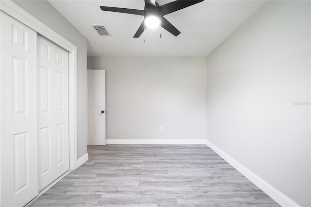 unfurnished bedroom featuring a closet, ceiling fan, and light hardwood / wood-style floors