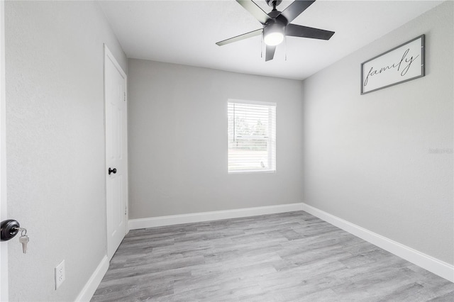 spare room with ceiling fan and light hardwood / wood-style floors