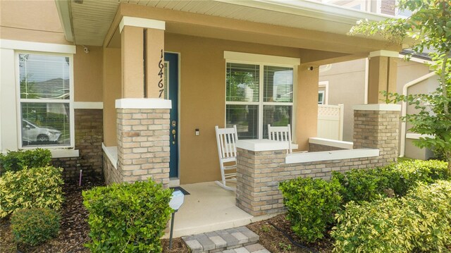 doorway to property featuring a porch