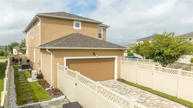 view of side of property featuring a garage