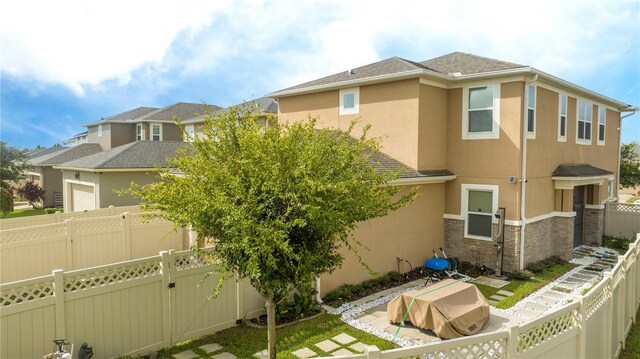 rear view of house with a patio area