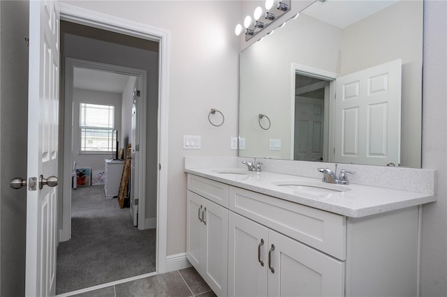 bathroom with tile patterned flooring and vanity