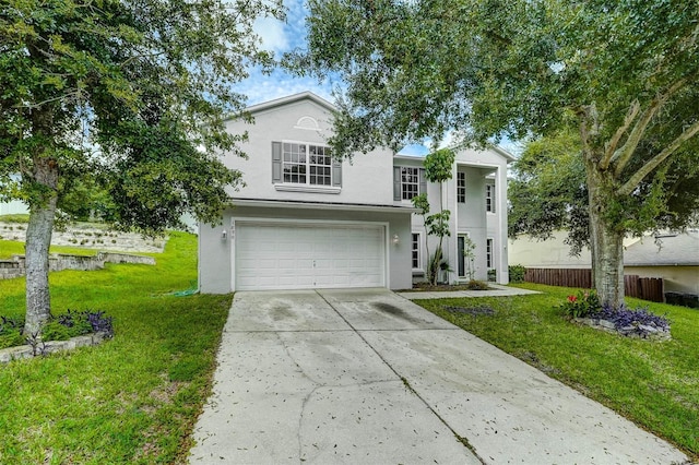 view of front of house with a garage and a front lawn