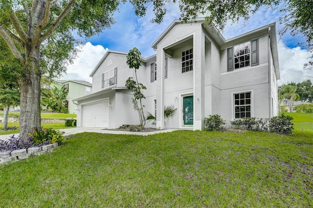 view of front facade featuring a front yard and a garage